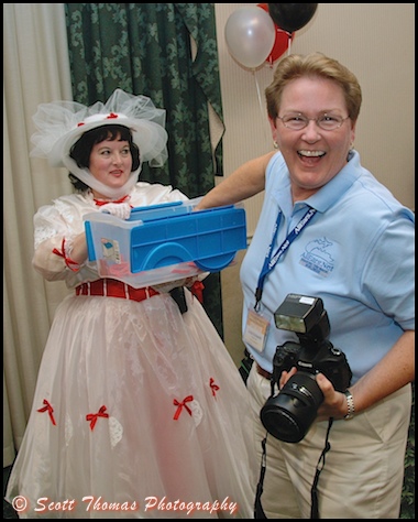 All Ears photographer Linda E pulls a lucky number with the help of Mary Poppins during the Meet before the Magic reception the night before MagicMeets, Harrisburg, Pennsylvania.