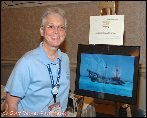 All Ears founder, Deb Wills, poses next to her poster of the Flying Dutchman before MagicMeets on Saturday, August 8, 2009, in Harrisburg, Pennsylvania.